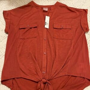 Button up shirt with tie knot at bottom